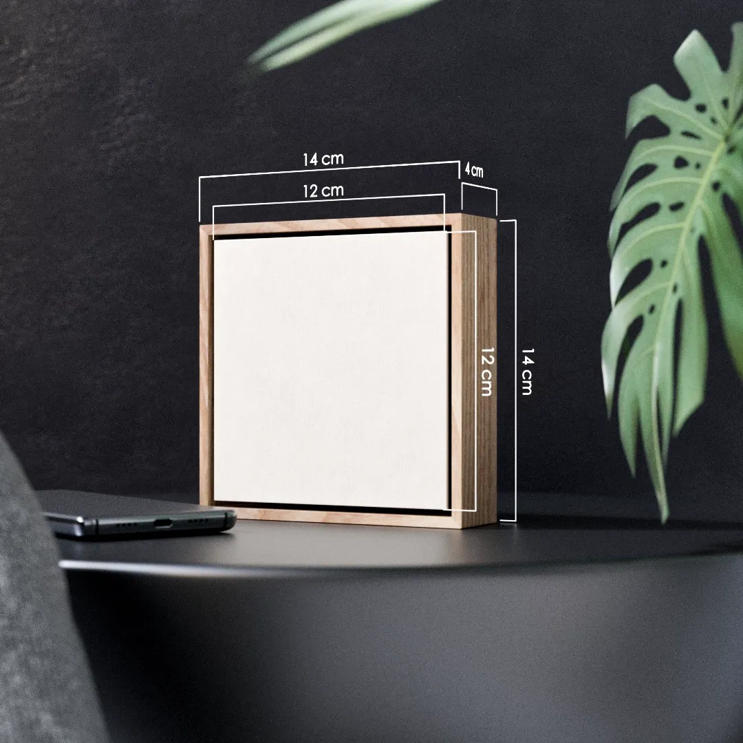 The framed miniature standing on a table: a 12 by 12 centimetre painting inside a 14 by 14 by 4 centimetre ash box frame